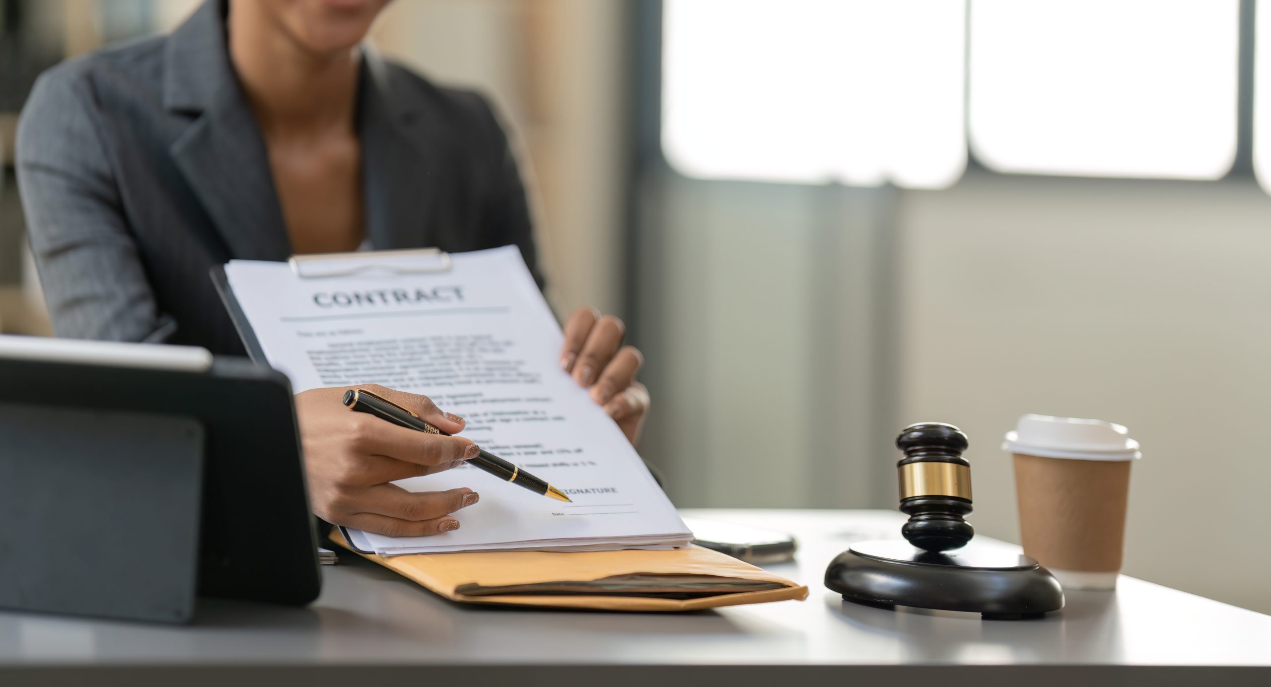 Woman lawyer working on a laptop. Legal law, advice and justice concept